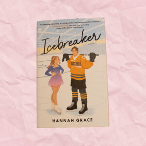 A book cover with a beautiful female figure skater and a handsome hockey boy on a ice rink
