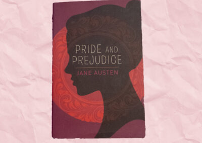 Maroon book cover with a silhouette of a woman's head. Pink background.